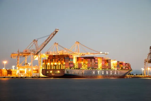 A container berth at dusk